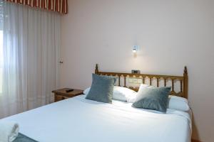 Postel nebo postele na pokoji v ubytování Hotel Alda Xinzo