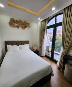 Ένα ή περισσότερα κρεβάτια σε δωμάτιο στο BREAKING DAWN- TAEYANG Hotel Phú Quốc