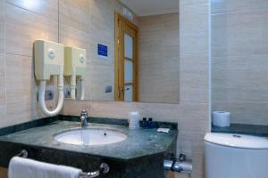 Koupelna v ubytování Hotel Alda Xinzo + 37 fotografií