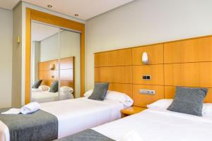 Postel nebo postele na pokoji v ubytování Hotel Alda Xinzo