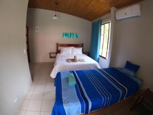 Postel nebo postele na pokoji v ubytování El Sueno Tropical