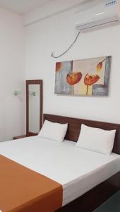 Postel nebo postele na pokoji v ubytování Leaf Dew Resort