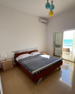 Postel nebo postele na pokoji v ubytování SeaView Apartments
