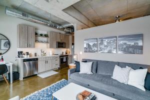 a living room with a couch and a kitchen at Sable 606 - One Bedroom in Minneapolis