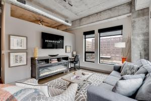 a living room with a couch and a tv at Sable 409 - One Bedroom in Minneapolis