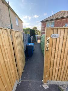 a gate to a house with a fence at 200A Ringwood Road in Poole