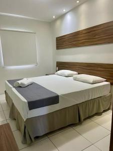 Postel nebo postele na pokoji v ubytování Hotel Pousada Alagoana