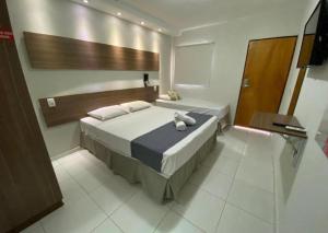 Postel nebo postele na pokoji v ubytování Hotel Pousada Alagoana