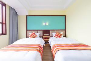 Letto o letti in una camera di Mu Lin Xi Inn - Zhangjiajie Tianmen Mountain Ropeway