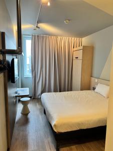 Posteľ alebo postele v izbe v ubytovaní ibis budget Nancy Laxou