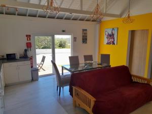 a living room with a couch and a table at Guesthouse Vista dos Cerros in Loulé
