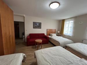 Postel nebo postele na pokoji v ubytování Penzion V Zatáčce