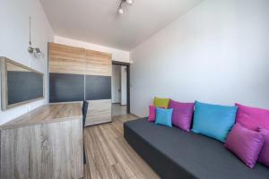 Televízia a/alebo spoločenská miestnosť v ubytovaní ApartamentyPrzyMorzu Classic Kołobrzeg