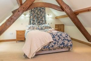 a bedroom with a bed in the attic at Bwthyn-Betws in Dolbenmaen