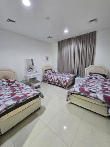 Ένα ή περισσότερα κρεβάτια σε δωμάτιο στο Shared room