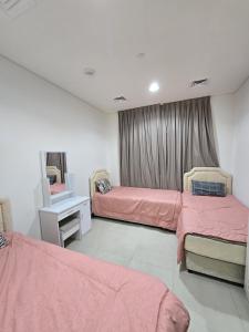 Ένα ή περισσότερα κρεβάτια σε δωμάτιο στο Shared room