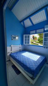 Ένα ή περισσότερα κρεβάτια σε δωμάτιο στο Bungalow charmant à Capesterre-Belle-Eau, 35 m², piscine