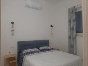 Postel nebo postele na pokoji v ubytování Casa vacanze il sorriso di Eva