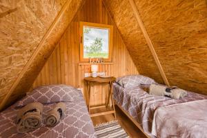Voodi või voodid majutusasutuse Komac Apartma & Glamping BLED toas +7 fotot