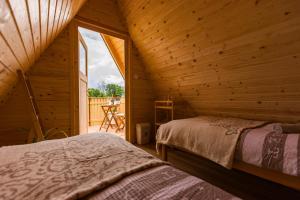 Voodi või voodid majutusasutuse Komac Apartma & Glamping BLED toas