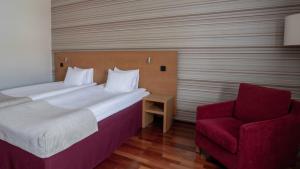 Voodi või voodid majutusasutuse Quality Hotel Royal Corner toas