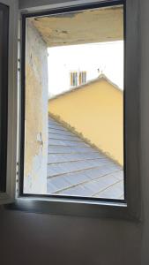 a window in a room with a view of a building at La CASA del PORTO ANTICO in Genoa