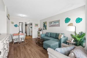 a living room with a couch and a table at One bedroom ocean front condo - Verandas708 in Myrtle Beach