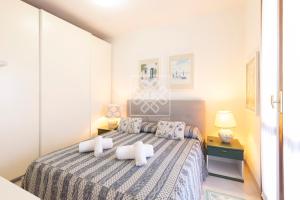 a bedroom with a bed with two pillows on it at Terrazza Celeste in Stintino +45 photos