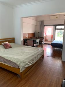 a bedroom with a bed and a living room at Riverhome Saigon Apartments in Ho Chi Minh City +95 photos