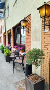 a group of benches sitting outside of a building at Locanda Antica Bribano in Sedico