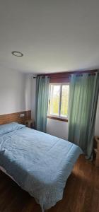 Ένα ή περισσότερα κρεβάτια σε δωμάτιο στο Apartamento San Simón
