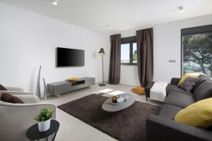 TV/trung tâm giải trí tại Villa Fasana-Apartment 4 by Vivi Rent