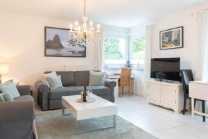 TV a/nebo společenská místnost v ubytování Ferienwohnung Mare Time 1