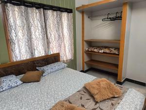 a bedroom with a large bed with a curtain and a bed at Little Hearts in Chennai +92 photos