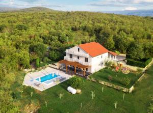 an aerial view of a house with a swimming pool at Villa Violet in Grude