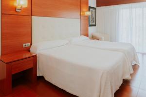 Postel nebo postele na pokoji v ubytování Hotel El Molino