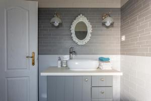 a bathroom with a sink and a mirror at Azur Villa in Balatonalmádi +44 photos
