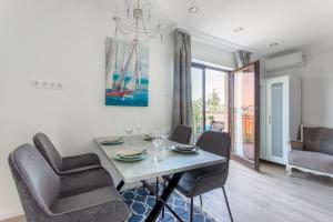 a dining room with a table and chairs at Azur Villa in Balatonalmádi