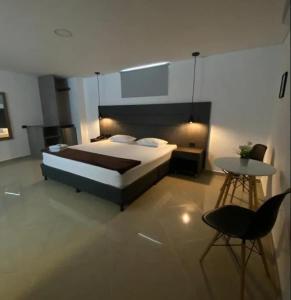 Postel nebo postele na pokoji v ubytování Hotel California Medellin