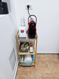 a small table with a blender on top of it at Casa vacanze Stella in Silvi Marina