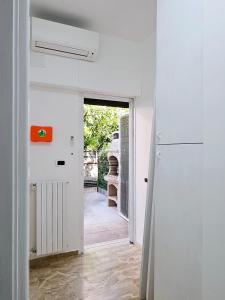 a hallway leading to a kitchen with a refrigerator at Casa vacanze Stella in Silvi Marina +6 photos