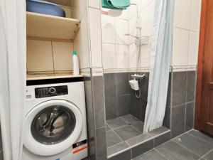 a washing machine in a bathroom with a shower at Cozy Ocean Park in Adeje