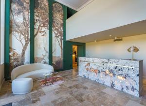 Posezení v ubytování Hôtel Le Clos des Arts