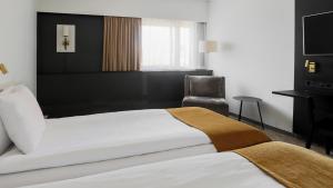Voodi või voodid majutusasutuse Quality Hotel Royal Corner toas