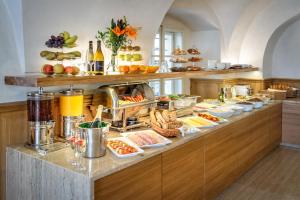 a kitchen filled with lots of different types of food at Golden Star in Prague
