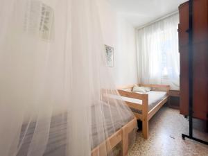 A bed or beds in a room at Zago
