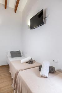 Postel nebo postele na pokoji v ubytování Iaia Carmen