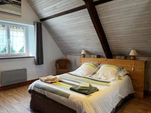Postel nebo postele na pokoji v ubytování Moulin de la Fosse Soucy "Les Merisiers"
