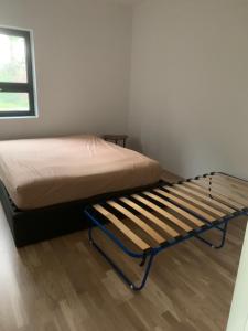 a small bedroom with a bed in a room at Bedroom&ensuite in Moss