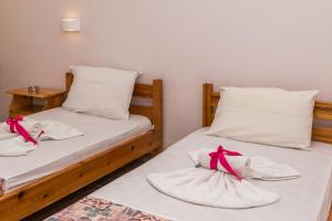 A bed or beds in a room at Roussa's Apartments